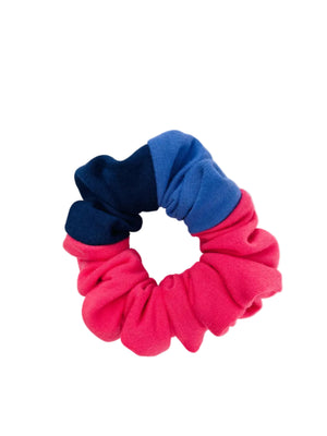 A scrunchie,  pink, navy & purple on a white background.