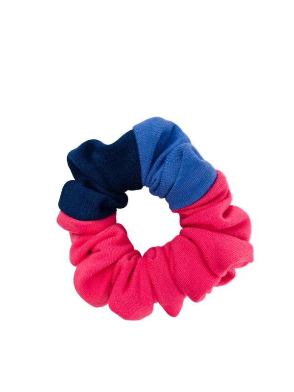 A scrunchie,  pink, navy & purple on a white background.