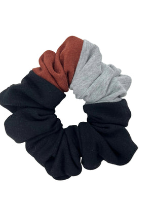 One scrunchie in black, gray, and brown on a white background