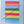 Colorful striped quilt on a white background