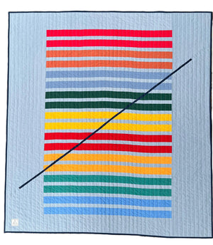 Colorful striped quilt on a white background