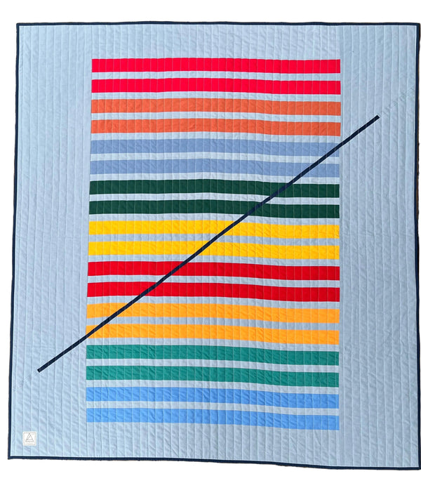 Colorful striped quilt on a white background